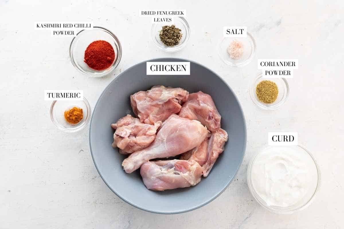 Ingredients to marinate the pressure cooker chicken curry with text overlay
