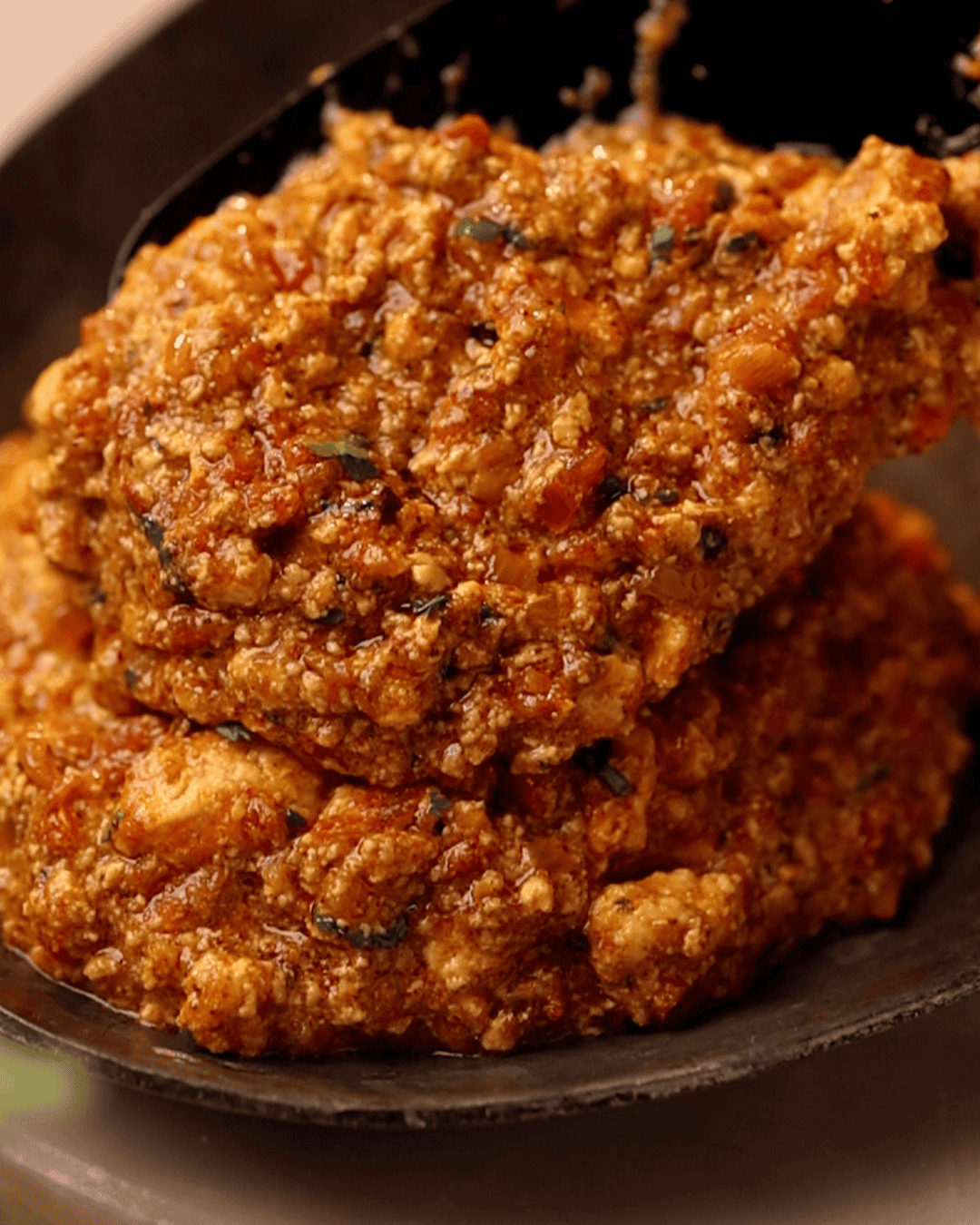 a close up shot amritsari paneer bhurji being served on a plate
