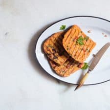 Masala french toast served from a large white plate.