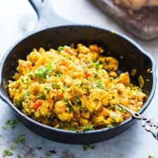 Paneer bhurji in a black skillet.