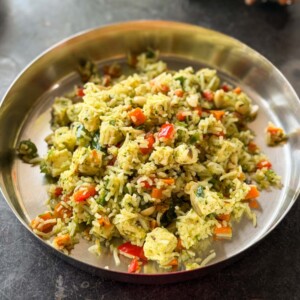 thecha paneer fried rice served in a steel plate