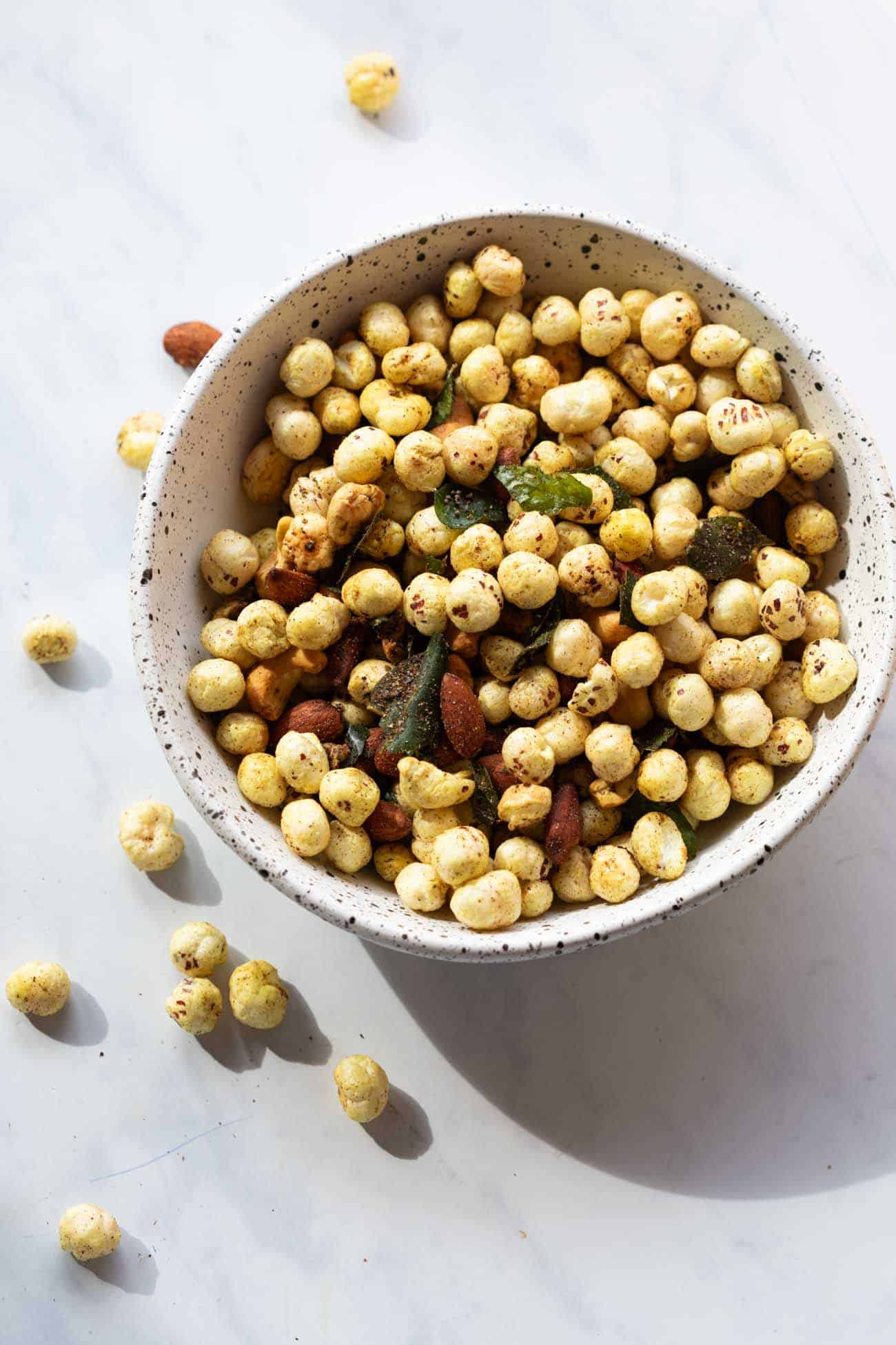 Roasted Makhana and Nuts served in a white bowl