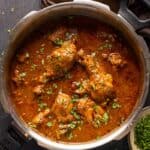 Dhaba style chicken curry served in the pressure cooker it was made in