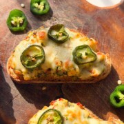 an image of jalapeno popper toasties served on a wooden board