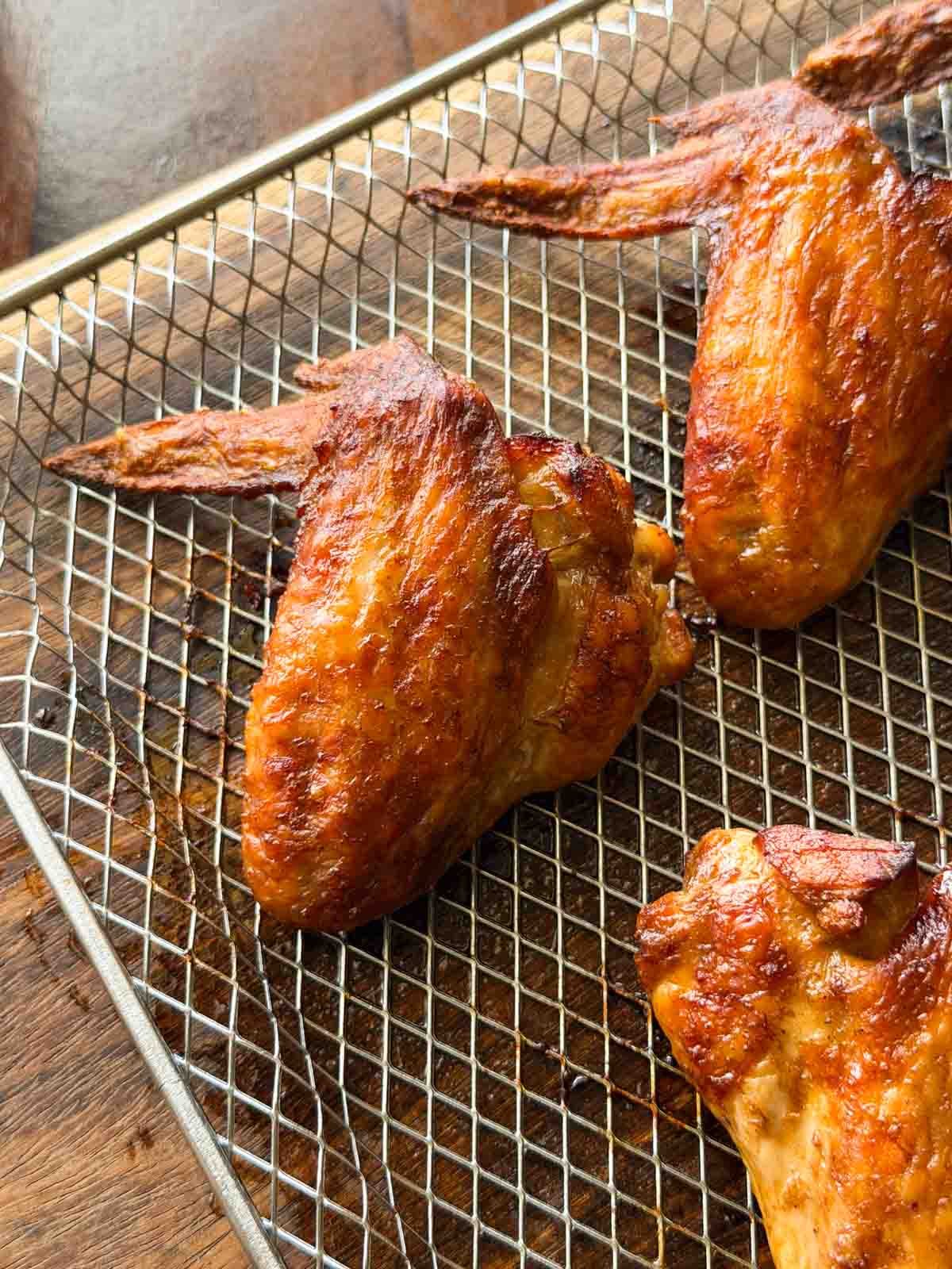 soy chicken wings in the air fryer tray ready to be served