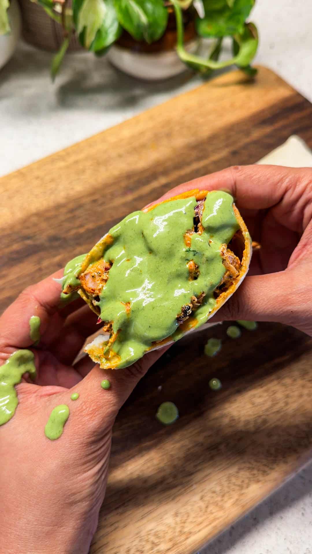 chicken tikka wrap with a drizzle of mint chutney